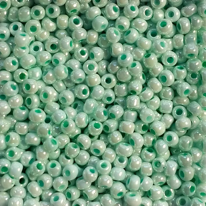 Lake Blue glass seed beads, close up
